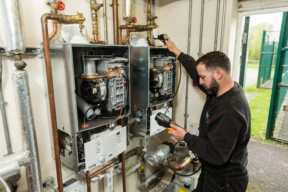 engineer reading a multi meter
